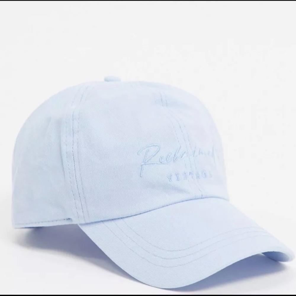 ASOS Reclaimed Vintage inspired logo embroidery cap in washed blue